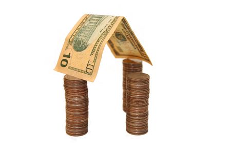 House made of money isolated on white backgroundの写真素材