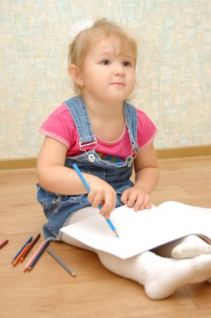 Small cute painting girl at home
の写真素材