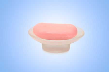 Glass soap dish with bar of soap の写真素材