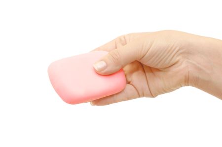 Soap in hand isolated on white backgroundの写真素材
