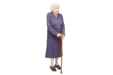 Grandmother holding a cane on white backgroundの写真素材