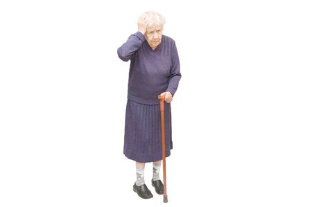 Grandmother holding a cane on white backgroundの写真素材