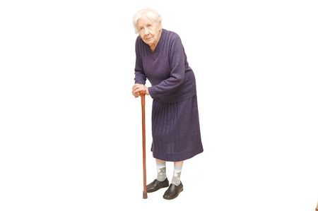 Grandmother holding a cane on white backgroundの写真素材