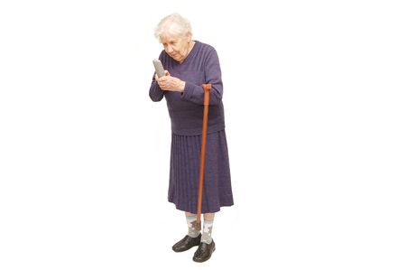 Grandmother holding a cane on white backgroundの写真素材