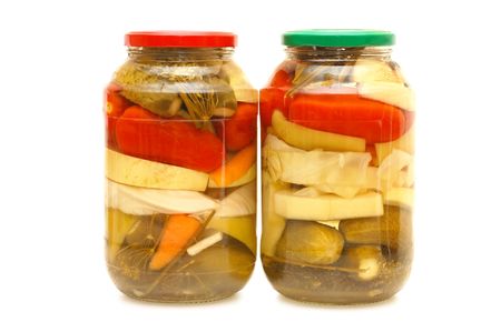 Glass jars with tinned vegetables isolated の写真素材