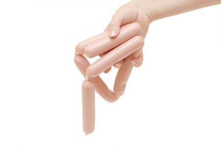 Fresh sausages in a hand isolated の写真素材