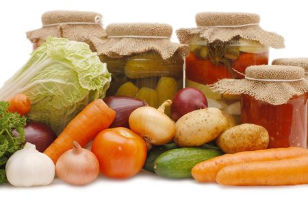 Fresh and tinned vegetables isolated on white の写真素材