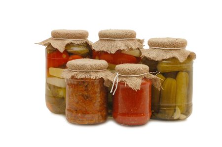 Glass jars with tinned vegetables isolated の写真素材