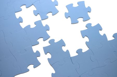 Dropped out part of a blue puzzleの写真素材