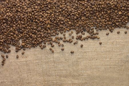 Brown coffee grains on a sackingの写真素材