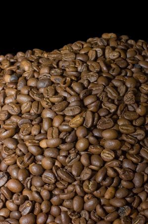 Fragrant coffee beans isolated on black backgroundの写真素材