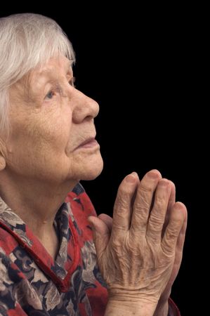 The old woman prays on a blackの写真素材