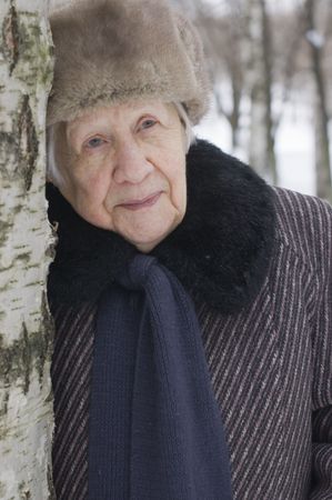 Portrait of the old woman in the winterの写真素材