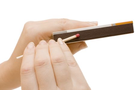 Matches in a hand isolated on whiteの写真素材