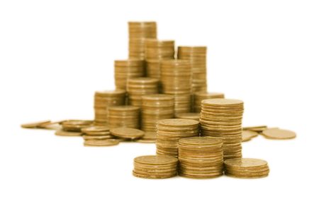 Golden coins isolated on white backgroundの写真素材