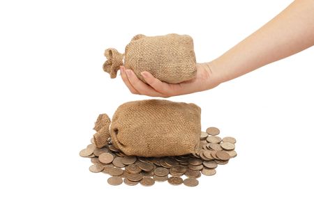 Bag with coins in a female handの写真素材