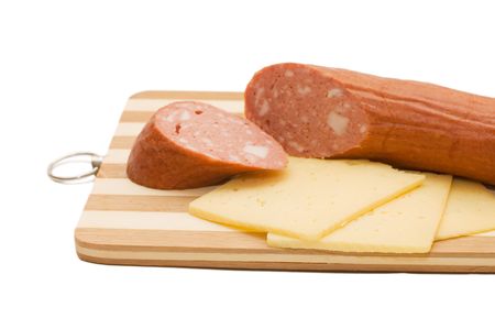 Cheese and sausage isolated on white backgroundの写真素材