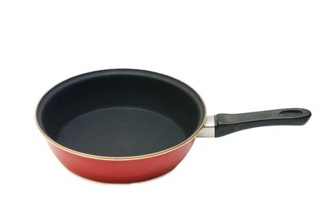Red frying pan isolated on white backgroundの写真素材