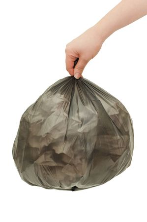 Black garbage bag In a female handの写真素材