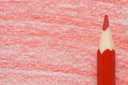 Red pencil with coloring on a  paperの写真素材