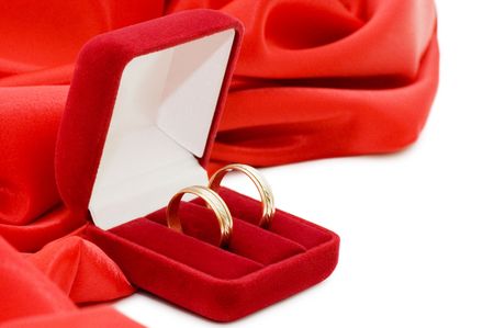 Red box with two gold wedding ringsの写真素材