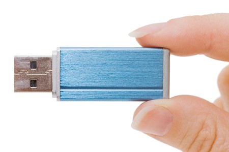 Flash drive in hand isolated on white background の写真素材