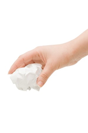 Hand and crumpled paper, isolated on white background の写真素材