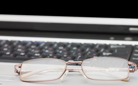 Glasses on the laptopの写真素材