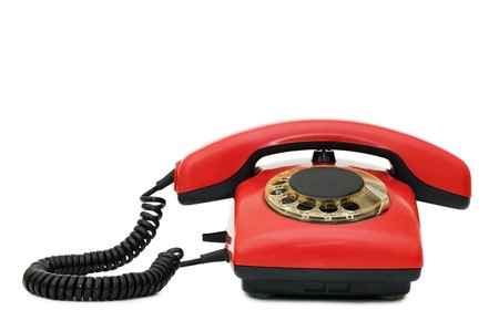 Red old telephone isolated on white の写真素材