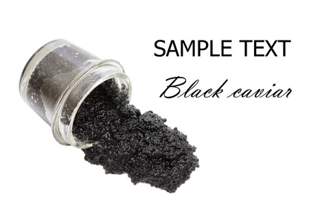 Black caviar in a glass jar on a white background の写真素材