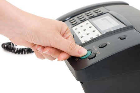 The hand presses the fax buttonの写真素材