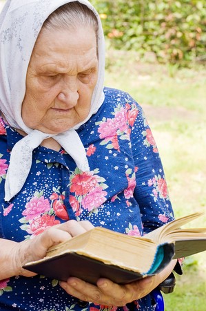 The old woman with the bibleの写真素材