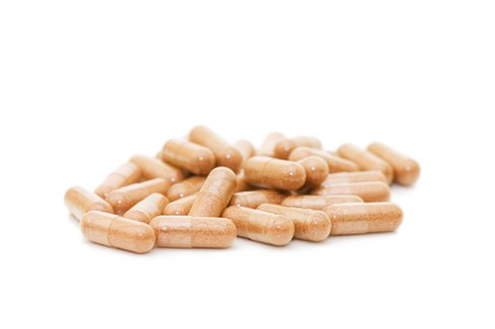 Heap of pills  isolated on white background の写真素材