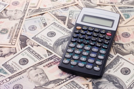 calculator on dollar background - business conceptの写真素材