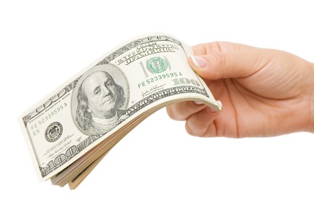 Money in hand, isolated on white background の写真素材