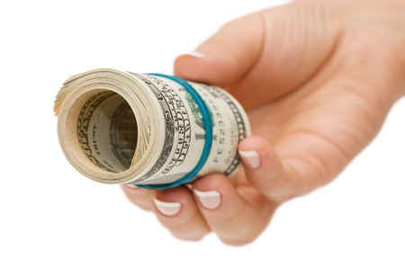 Hand with money isolated on white background の写真素材