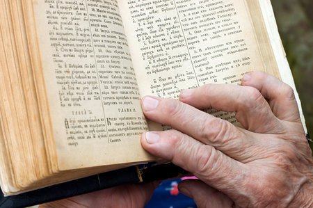 The old woman reads the bible