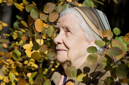 Beautiful portrait of an elder woman outdoorsの写真素材
