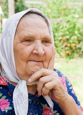 Portrait of the old woman in a scarfの写真素材