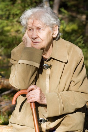 Beautiful portrait of an elder woman outdoorsの写真素材