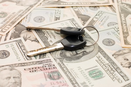 Dollar banknotes and pen keyの写真素材