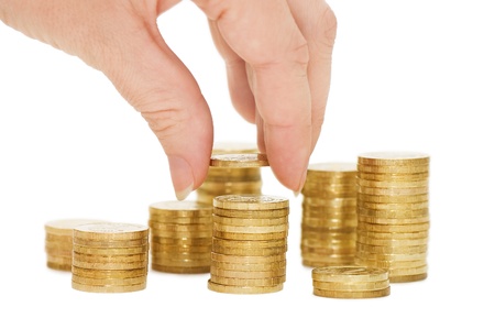 Hands with coins isolated on white background の写真素材