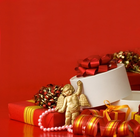 Box with a gift on a red backgroundの写真素材