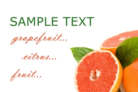 Fresh juicy grapefruits with green leafs. Isolatedの写真素材