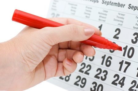 Hand writing important date isolated on white backgroundの写真素材