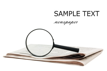 Magnify glass over a of newspaperの写真素材