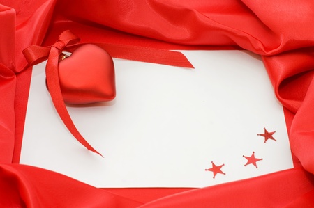 Pure sheet papers on a red fabricの写真素材