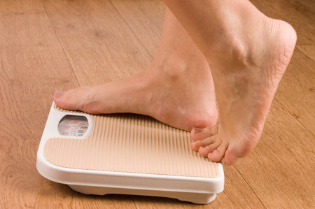 Female feet on scales