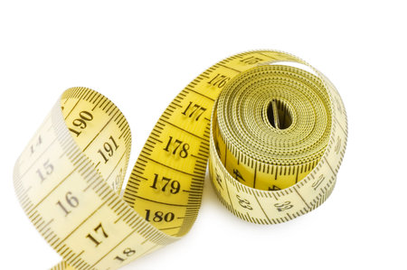 Yellow measuring tape isolated on white background