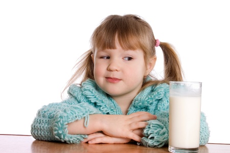 The little girl with a milk glassの写真素材
